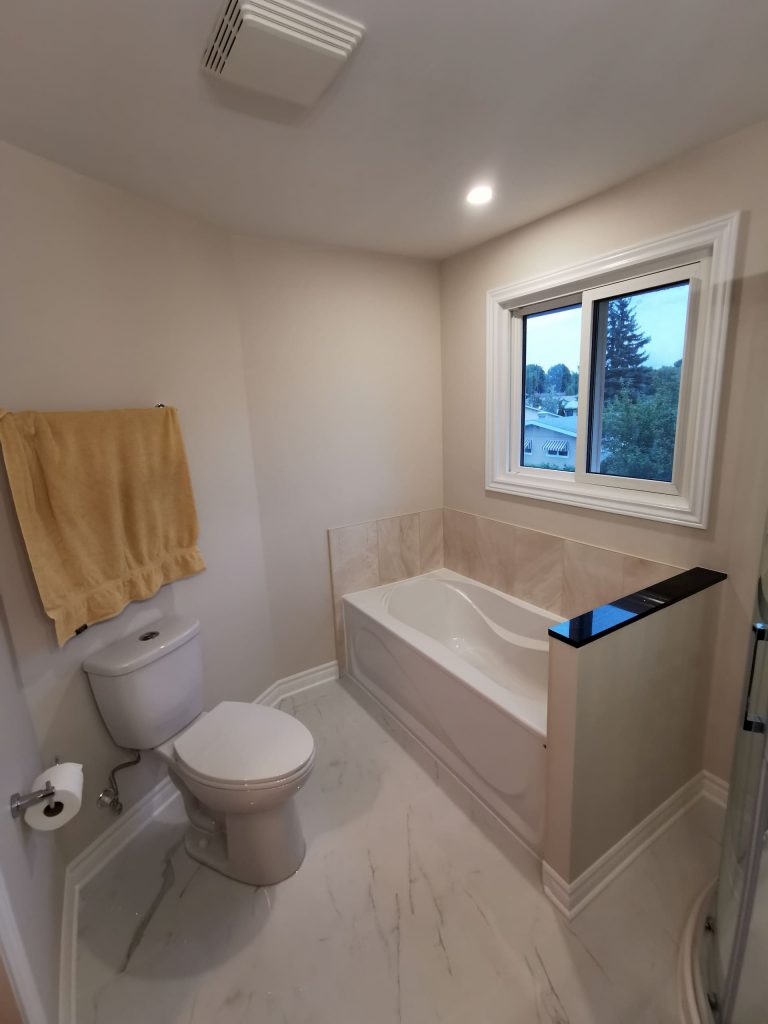 luxury bathroom with small bathtub - renovations ottawa